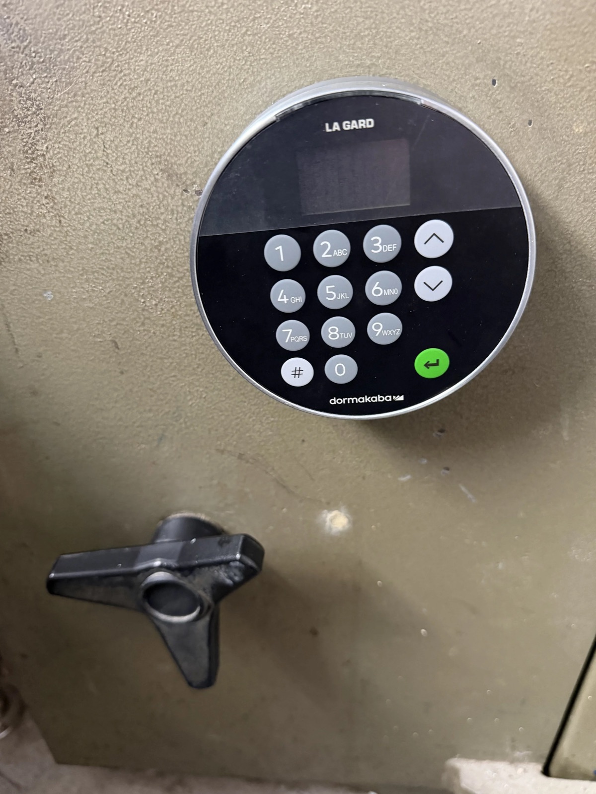 An electronic safe lock upgrade installed on an existing safe