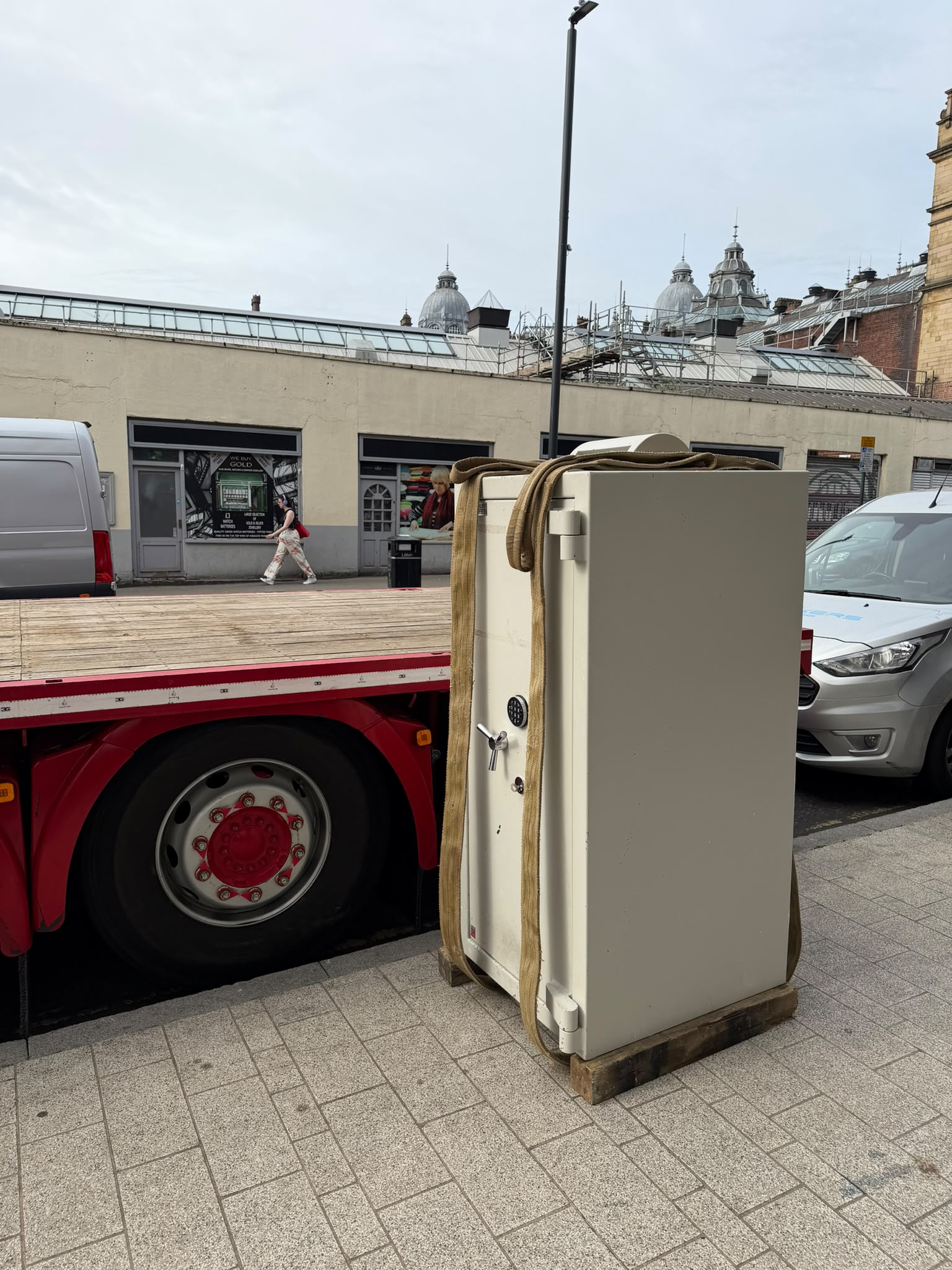 A large safe secured beside a specialist transport vehicle