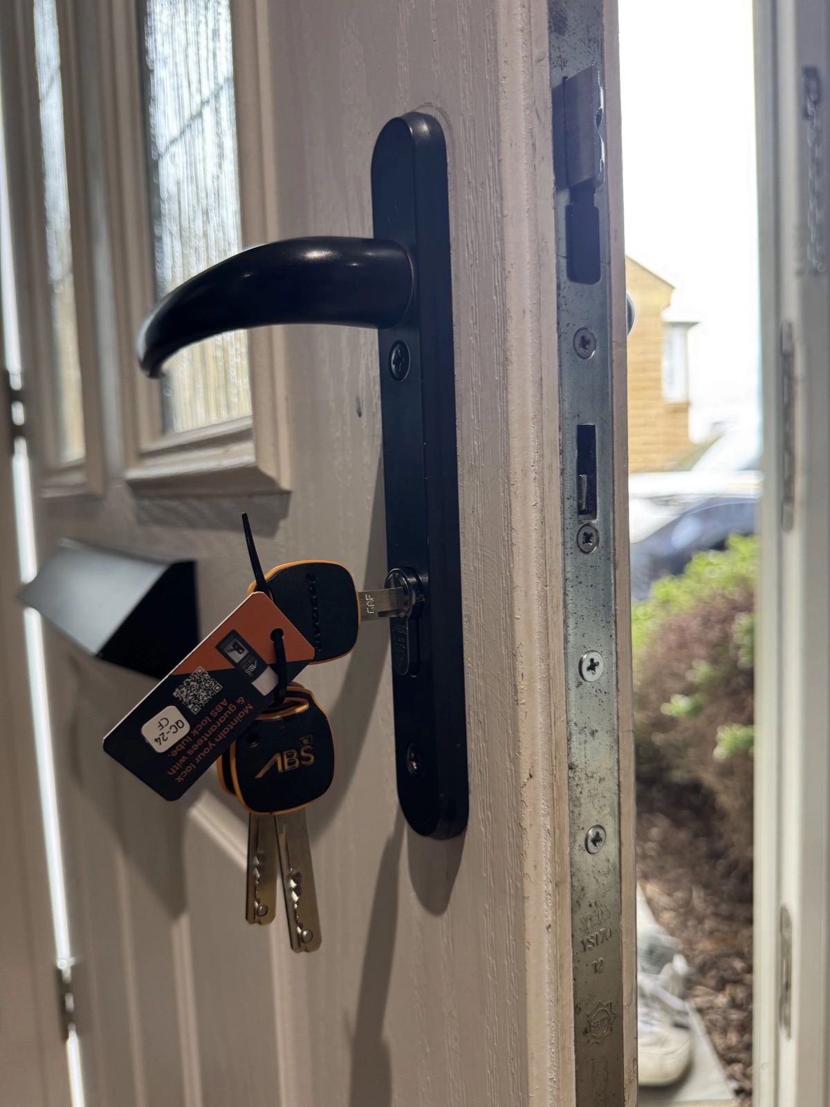 A high-security lock fitted to a uPVC front door